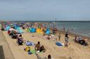 People enjoying the weather on Sea Palling Beach