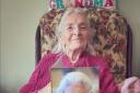 Joan Garnham with her 100th birthday card from the Queen