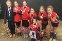 Norwich Dragons' Team Danson, named after England captain Alex Danson,  show off their gold medals after winning the Under-10 Gold Tournament at Harleston Picture: CLUB