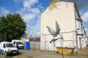 The Banksy seagull artwork prior to its removal from the end terraced house in Lowestoft.