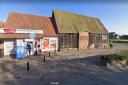 The OneStop shop in Banham and derelict barn next to it