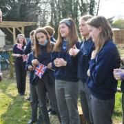 Deputy Lieutenant for Norfolk  Lt Col Ian Lonsdale with students from Diss High School on their allotment