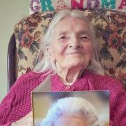 Joan Garnham with her 100th birthday card from the Queen