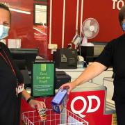 Staff members at QD's Gorleston store, pictured at the shop's food bank collection point