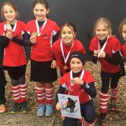Norwich Dragons' Team Danson, named after England captain Alex Danson,  show off their gold medals after winning the Under-10 Gold Tournament at Harleston Picture: CLUB