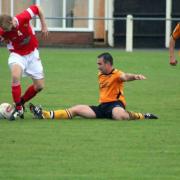 Stephen Harvey, grounded, in action for Fakenham Town. Picture: TONY MILES