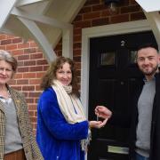 Cllr Lavinia Hadingham, Mid Suffolk District Council’s cabinet member for housing receives the keys to the nine new affordable homes from Oliver Burgess sales and marketing director at Burgess Homes with ward member Cllr Jessica Fleming.