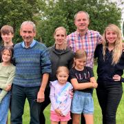 Geoff Gapp (centre) and his family have raised £60,000 for cancer research in memory of his late wife Gunvor (inset)