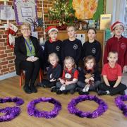 Garboldisham CofE Primary Academy headteacher Moira Croskell and pupils celebrate its Ofsted success